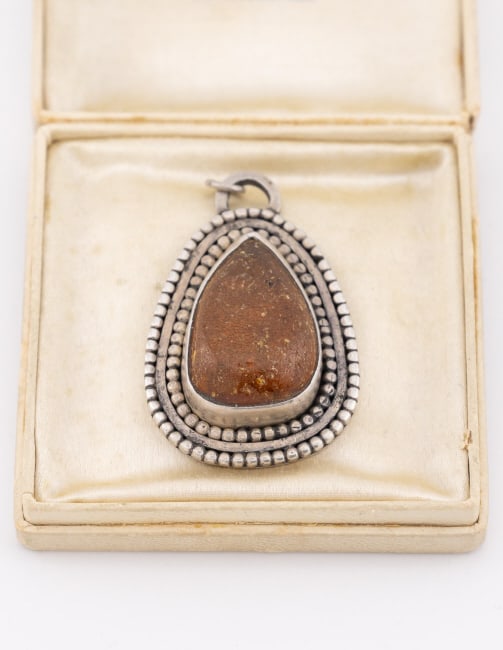 Vintage C Schwartz Sterling Silver Amber Pendant: Vintage C Schwartz Sterling Silver Amber Necklace Pendant. Signed and hallmarked on the back. Measures approximately 1.75 inches in length. Bezel set amber at center in pear shape.