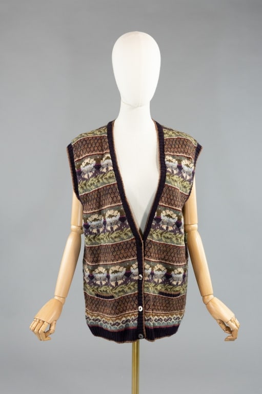Vintage 1980s Carrie Knit Wool Sweater Vest: Vintage 1980s Carrie Knit Wool Sweater Vest having print throughout and button closure down center front. Measuring 41 inch bust, 27 inches long with stretch throughout.