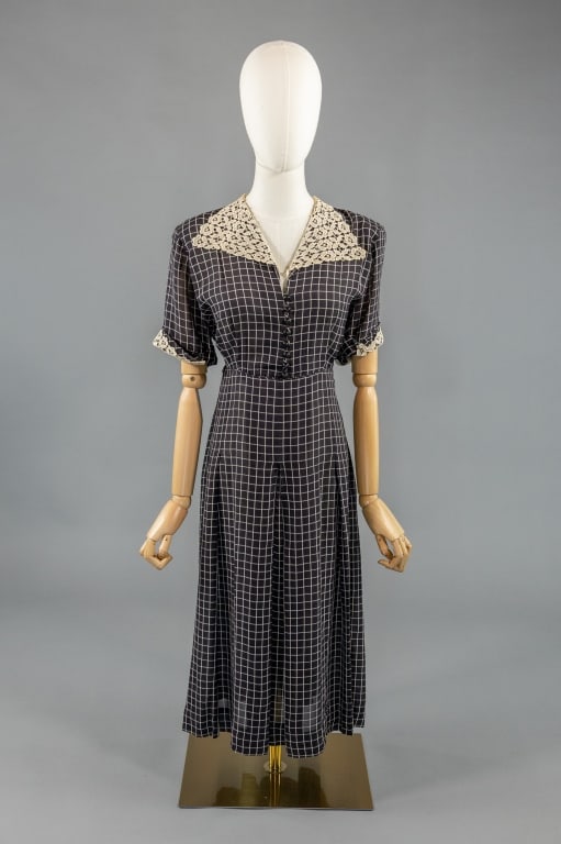 Vintage 1950s Black Checkered Rayon Day Dress: Vintage 1950s Black Checkered Rayon Day Dress having lace collar and buttons down center front with side zip. Labeled Mynette. Measuring 38 inch bust, 28 inch waist, 44 inches long, 10 inch sleeve len
