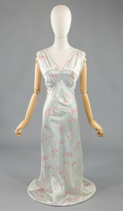 Vintage 1940s Rayon Satin Floral Print Slip Dress: Vintage 1940s Rayon Satin Floral Print Slip Dress having ruched cups and Deco seaming throughout. Light wear as shown. Measuring 32-38 inch bust, 26-34 inch waist, 57 inches long.
