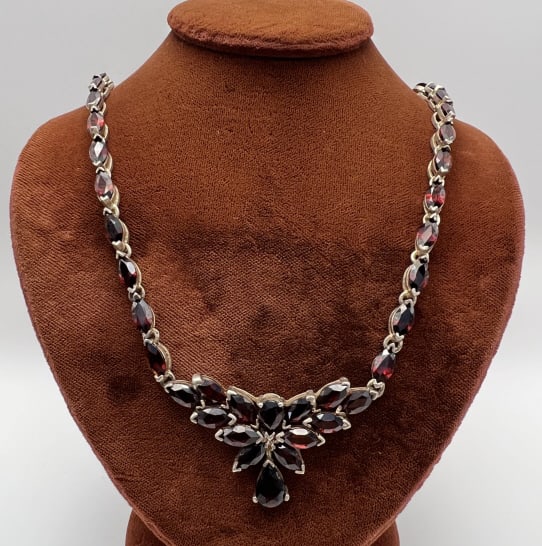 Impressive Sterling Silver Marquis Garnet Necklace: Impressive Sterling Silver Marquis Garnet Necklace. Articulated sterling silver setting with marquis / navette cut red garnets. Clasp is hallmarked. Measures 16 inches in length.