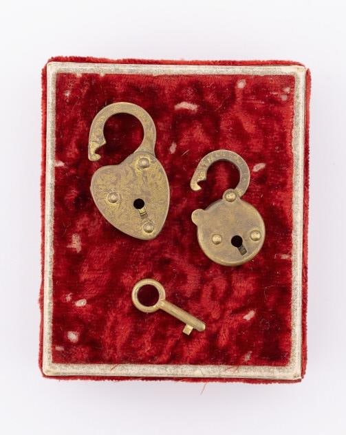 Two Vintage Gilt Metal Heart Form Padlock Charms: Two Vintage Gilt Metal Heart Form Padlock Charms / Pendant. One heart form and one round design with key. The one with the key measures 1 inch in length.