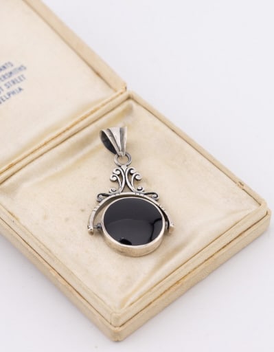 Sterling Onyx & Mother of Pearl Spinner Pendant: Estate / Vintage Sterling Silver Onyx & Mother of Pearl Spinner Fob or Necklace Pendant. Measures just under 1.75 inches in length.