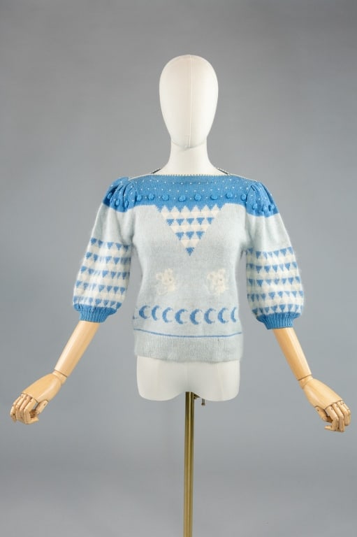 Vintage 1980s Blue Angora Knit Mouse Sweater: Vintage 1980s Angora Knit Mouse Sweater having puff sleeves, geometric, mouse, and moon designs. Labeled Sandy. Measuring 34 - 40 inch bust, 32 inch waist, 20 inches long, 16 inch sleeve length with s