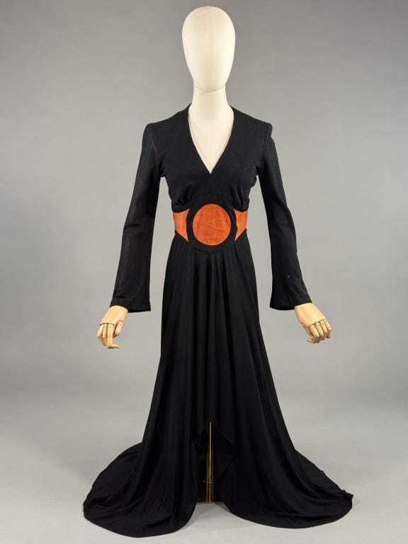 Vintage 1970s Mr. Boots Black Maxi Mod Dress: Vintage 1970s Mr. Boots Black Maxi Mod Color Block Dress having ultrasuede inset details at waist and deep v-neckline. Zips up center back to close. Small hole at sleeve, light wear throughout. Marked