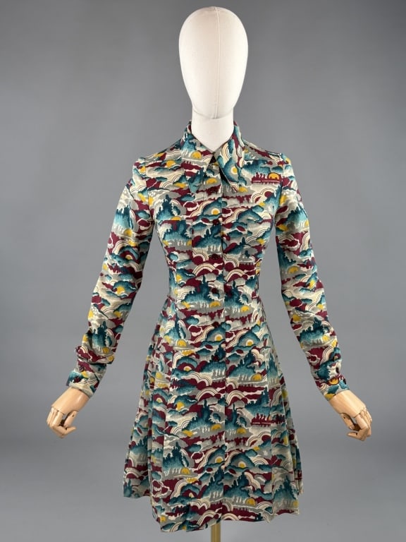 Vintage 1970s French Novelty Print Shirt Dress: Vintage 1970s French Novelty Print Shirt Dress having dagger collar and long sleeves with button closure up center front and pleats through skirt. Made in France for The Village Store New York. Measur