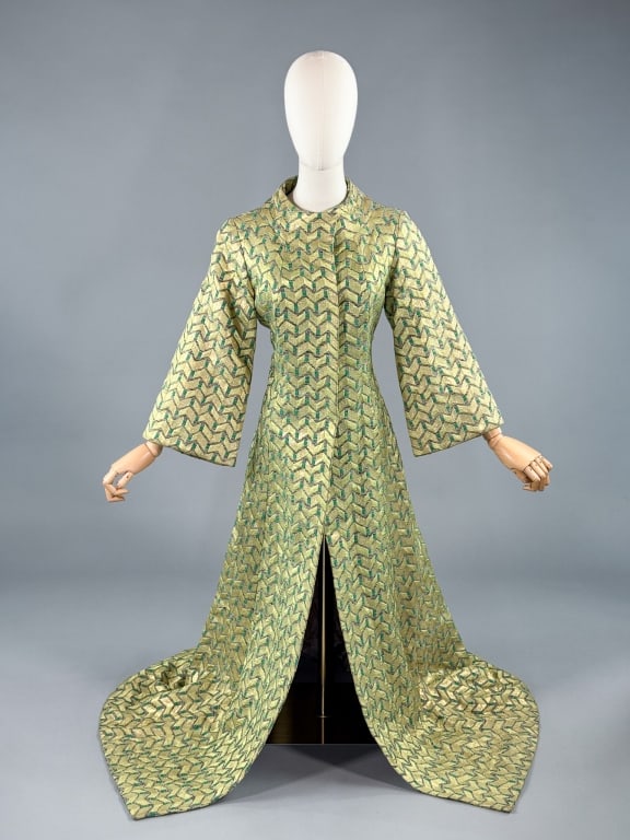 Vintage 1960s Geometric Lame Long Coat Jacket: Vintage 1960s Geometric Lame Long Coat Jacket having mock neck with bell sleeves and snap front closure, fully lined. Measuring 36 inch bust, 58 inches long, 20 inch sleeve length.