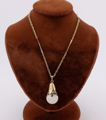 Vintage Gold Filled Floating Opal Pendant on Chain: Vintage Gold Filled Floating Opal Pendant on Chain. Yellow gold filled necklace chain with glass pendant mounted with gold filled setting filled with opal pieces. Chain measures 16 inches, pendant mea