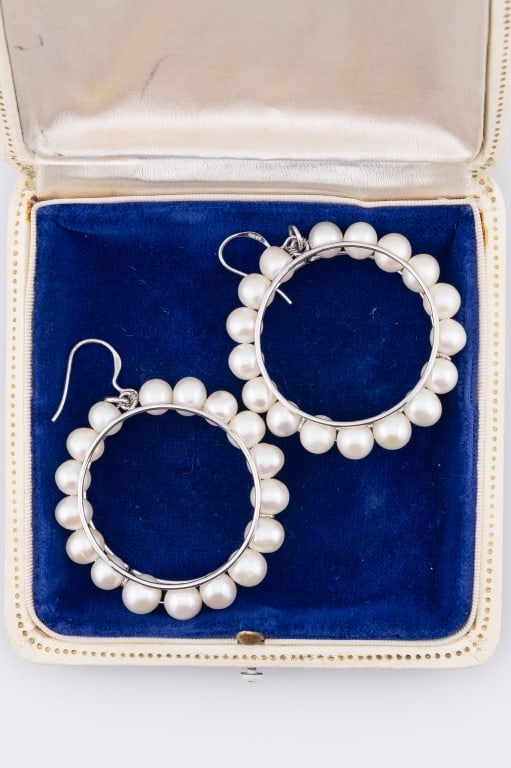Sterling Silver & Cultured Baroque Pearl Earrings: Pair of Sterling Silver & Cultured Baroque Pearl Earrings. Hoop design pendants extending from sterling silver ear wire. Hallmarked. Each measures 2.25 inches in length, hoops are 1.75 inches in diame