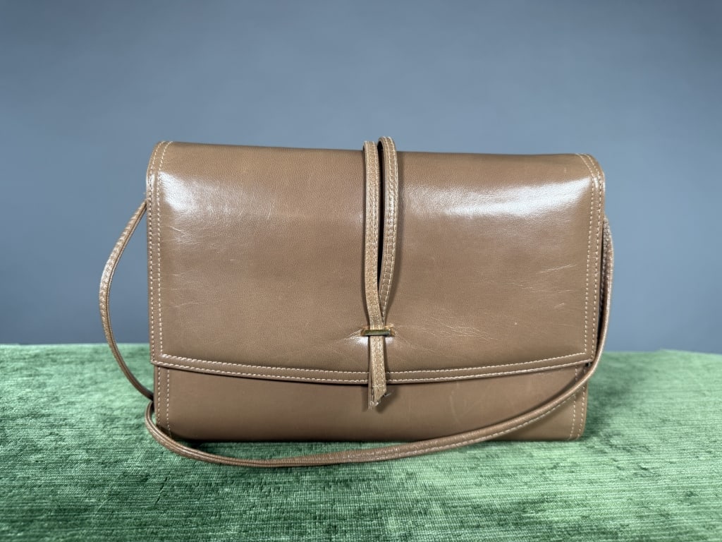 Vintage 1960s Jay Herbert Leather Bag Purse: Vintage 1960s Jay Herbert Leather Bag Purse having strap detail at front with magnetic snap closure and removable shoulder strap. Two interior pockets, one zippered. Measuring approximately 7 inches l