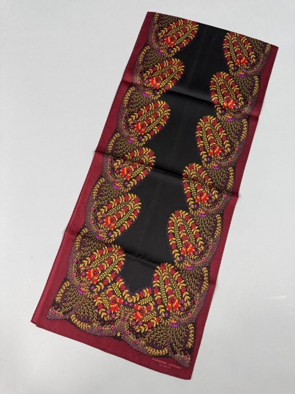 Vintage Adrienne Landau Silk Floral Printed Scarf: Vintage Adrienne Landau Silk Floral Printed Scarf having floral print throughout marked Adrienne Landau Studio at corner. Measuring approximately 54 inches long by 11 inches wide.