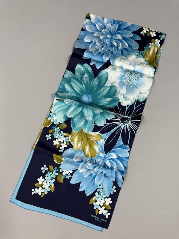 Vintage Adrienne Landau Silk Floral Printed Scarf: Vintage Adrienne Landau Silk Floral Printed Scarf having floral print throughout marked Adrienne Landau Studio at corner. Measuring approximately 54 inches long by 11 inches wide.