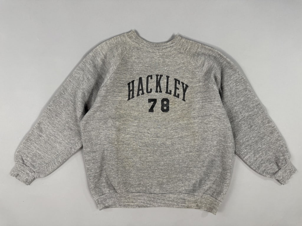Vintage 1970s Hackley School Grey Sweatshirt: Vintage 1970s Hackley School Grey Sweatshirt having HACKLEY 78 graphic at chest, crew neck, and raglan sleeves. Measuring 22 inches flat across chest, 23 inches long, 25 inch sleeve length from neck w