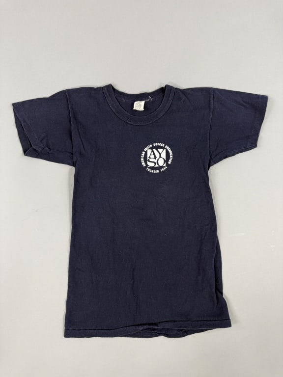 Vintage 1970s American Youth Soccer Tee Shirt: Vintage 1970s American Youth Soccer Tee Shirt having graphic at chest. Marked all cotton - size L on tag. Measuring 15 inches flat across chest, 22 inches long, 5 inch sleeve length with stretch throu