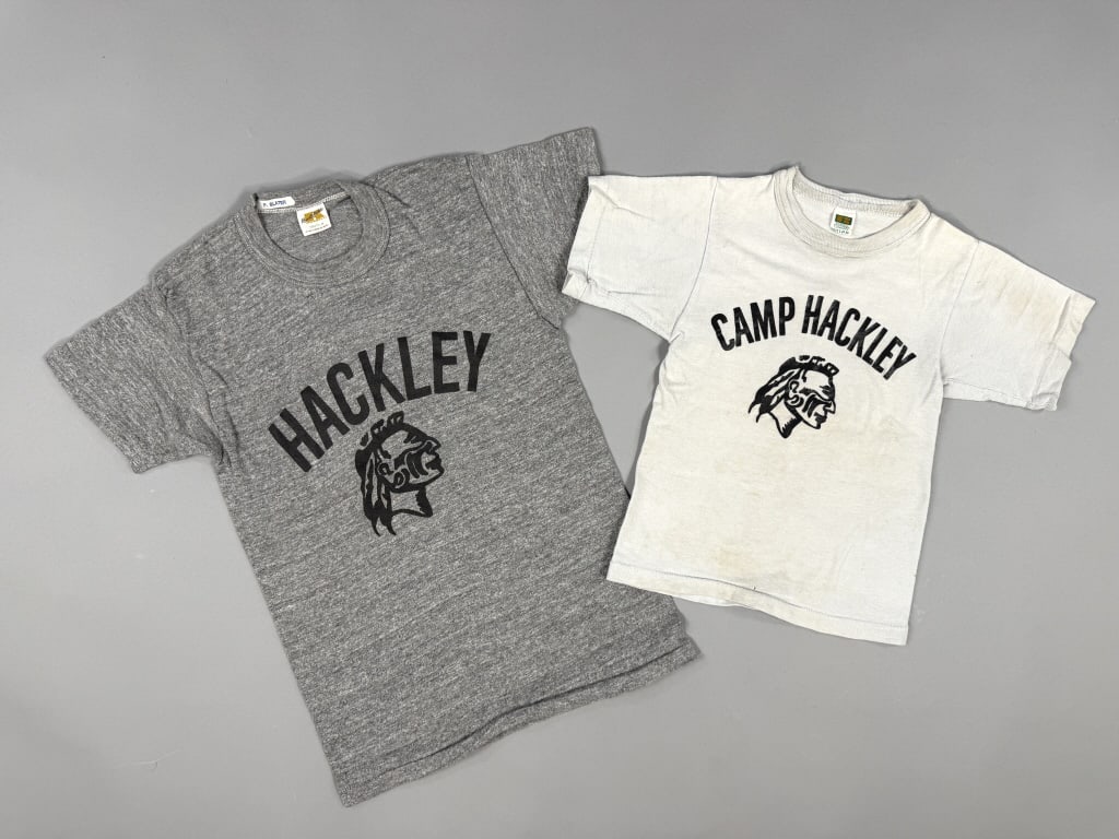 Vintage 1970s Camp Hackley Chief Head Tee Shirts: Vintage 1970s Camp Hackley Chief Head Tee Shirts having graphics at front of both. Larger marked Youth M - smaller marked Boys S. Larger measuring 15 inches flat across chest, 22 inches long, 5 inch s