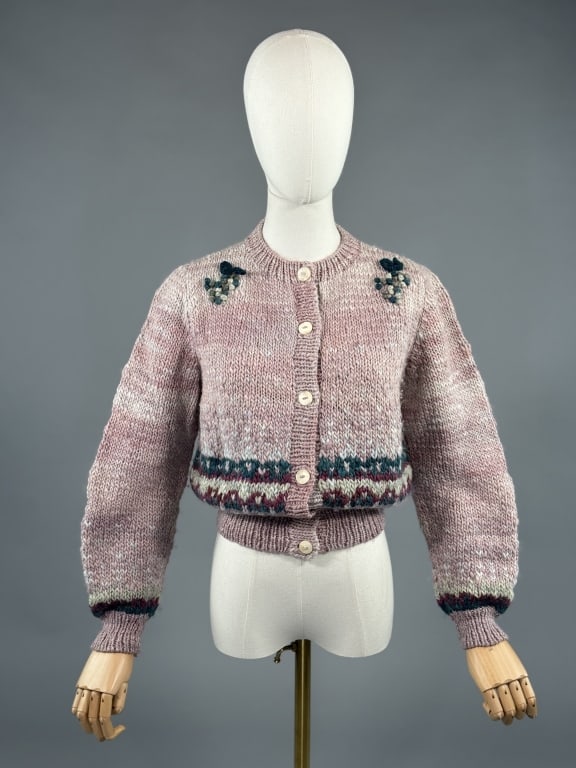 Vintage 1970s Manos del Uruguay Hand Knit Sweater: Vintage 1970s Manos del Uruguay Hand Knit Cardigan Sweater having yarn appliques at shoulders, stripes at bottom hem, and button closure up center front. 100% wool. Measuring 20 inches flat across che