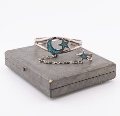 Silver Crescent Moon & Star Bracelet w Ring: Silver Crescent Moon & Star Design Bracelet w Attached Ring. Cuff bracelet measures approximately 2.25 inches across the interior opening. Ring is a size 7. May be lower grade than sterling or silver