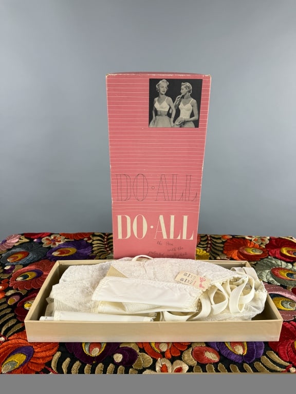 Collection of 1950s Lace Embroidered Bullet Bras: Collection of New Old Stock NOS 1950s Lace Embroidered Bullet Bras. With original box. Four in total, all marked 34C. Brand new with tags still attached. 100% Nylon. Elastic at back stretches to fit.