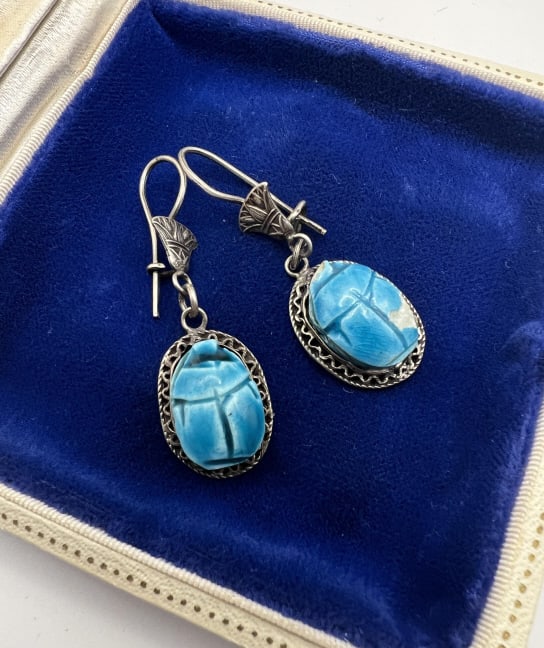 Pair of Egyptian Silver & Faience Scarab Earrings: Pair of Egyptian Silver & Faience Scarab Earrings. Hallmarked with Egyptian hallmarks. Each measures 2 inches in length.