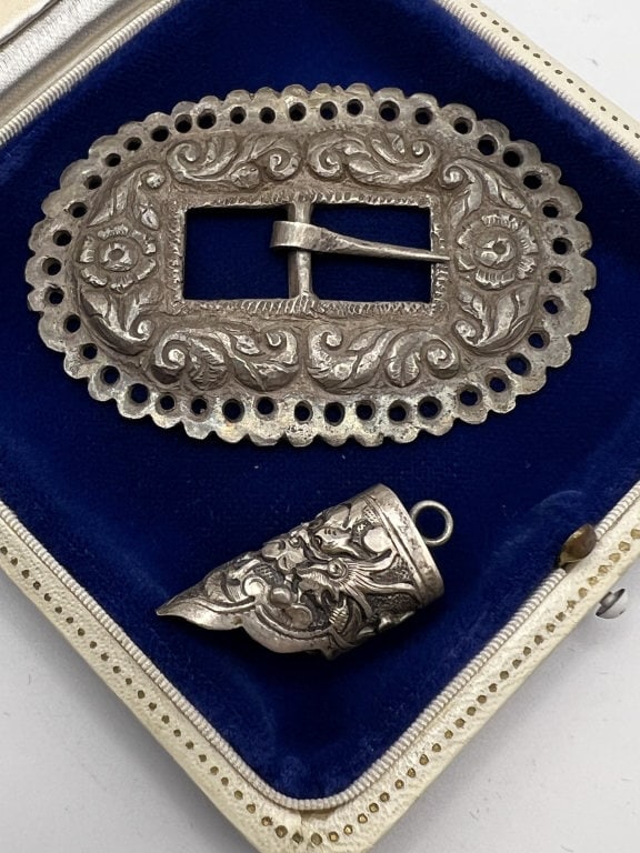 Antique Chinese Export Silver Buckle & Pendant: Antique Chinese Export Silver Buckle & Pendant. Antique chased silver necklace pendant with dragon motif and a buckle with floral motif. Buckle measures nearly 2.75 inches in length.