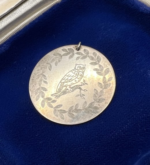 Vintage Sterling Silver Owl Necklace Pedant: Vintage Sterling Silver Owl Necklace Pedant. Engraved scene of owl within wreath frame. Hallmarked. Measures 1.25 inches in diameter.