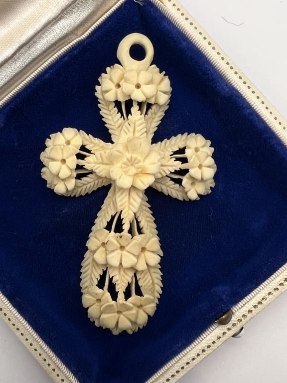 Antique 19th C Victorian Carved Bone Cross Pendant: Antique 19th C Victorian Carved Bone Cross Pendant. Finely hand carved with ornate detail of flowers and leaves, carved in ox or cow bone. Measures just over 3 inches in length.