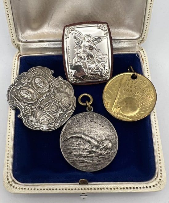 Collection of Medals - Sterling, Worlds Fair, WWII: Collection of Medals - Sterling, Worlds Fair, WWII. Italian sterling silver religious medal, World's Fair 1939 medal, WWII 1914 medal, swim trophy medal. Sterling one is hallmarked and measures just o