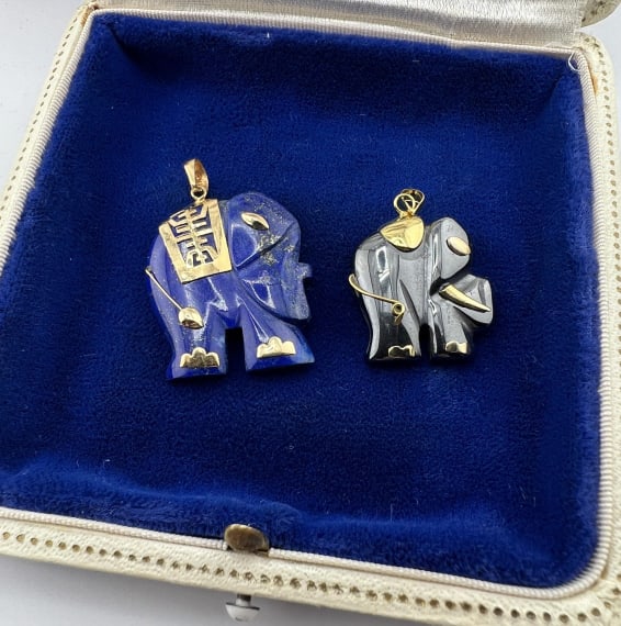 Estate 14kt Gold Lapis & Hematite Elephant Pendant: Estate 14kt Gold Lapis & Hematite Elephant Pendants. The carved lapis lazuli is mounted in 14kt yellow gold. The carved hematite is set in gold plated or gold filled. Lapis measures 1.25 inches in len