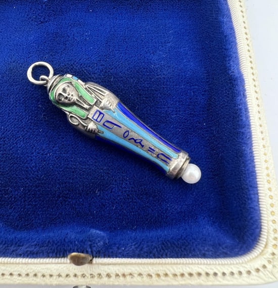 Antique Sterling & Enamel Egyptian Revival Pendant: Antique Sterling & Enamel Egyptian Revival Pendant. Measures 2 inches in length. Sterling silver with multi color enamel decoration across the surface of Sarcophagus design.