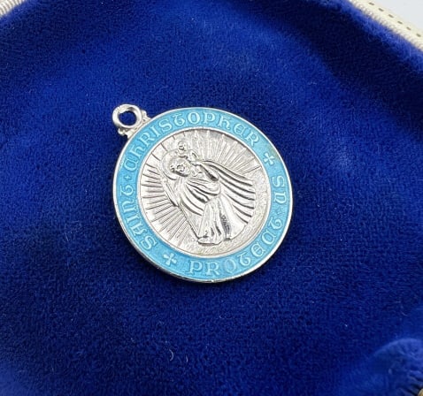 Estate Sterling Silver Enamel St Christopher Medal: Estate Sterling Silver Enamel St Christopher Medal Necklace Pendant. Sterling silver with blue enamel frame reading Saint Christopher Protect Us. Hallmarked on the back. Measures 1 inch in diameter.