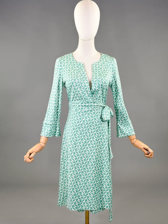 Vintage 2000s Diane von Furstenberg Wrap Dress: Vintage 2000s Diane von Furstenberg Wrap Dress having plunging neckline with wrap closure at waist. Marked size 8 with stretch throughout. Measuring 34 inch bust, adjustable waist, 40 inches long, 20