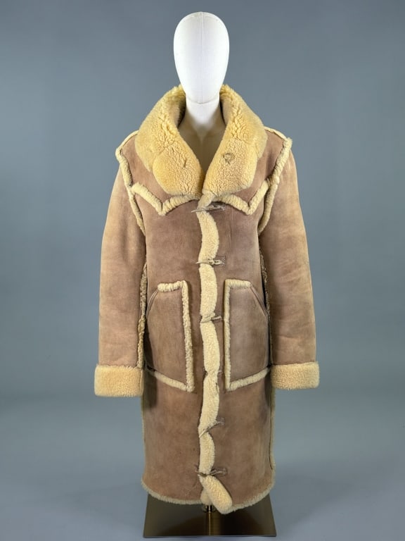 Vintage 1970s Shearling Fur Suede Leather Coat: Vintage 1970s Shearling Fur Suede Leather Coat having shawl collar at neck with horn toggle button closures down center front and two front patch pockets, Western detail at front & back yoke. Measurin