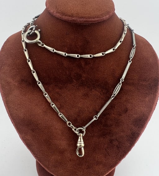 Antique 14k White Gold Filled Watch Chain Necklace: Antique 14k White Gold Filled Watch Chain Necklace. Hallmarked 1 - 10 - 14K GOLD FILLED. Set with two spring rings and a dog clip for charms / pendants. Measures approximately 21 inches in length.