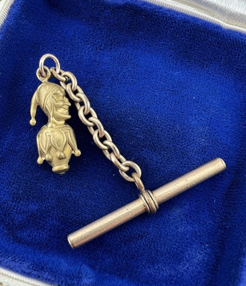 Antique 19th C Watch Fob Pendant & T Bar on Chain: Antique 19th C Watch Fob Pendant & T Bar on Chain. Court jester design pendant or fob. Measures nearly 2 inches in length overall.