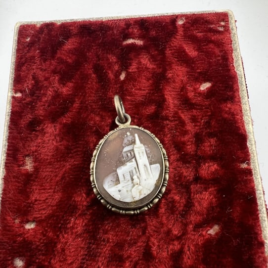 Antique 19th C Castle Scene Cameo Necklace Pendant: Antique 19th C Castle Scene Cameo Necklace Pendant. Hand carved natural sea shell cameo. In gilt or gold filled setting. Measures just over 1 inch in length.