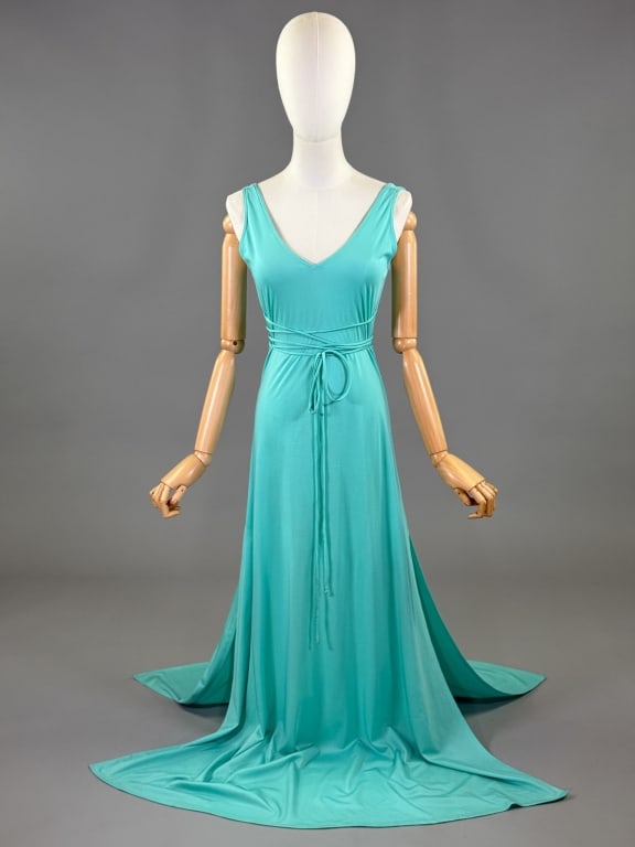 Vintage 1970s Aqua Polyester Knit Disco Maxi Dress: Vintage 1970s Aqua Polyester Knit Disco Maxi Dress having v-neckline with attached ties at side seams that wrap around body. Labeled Blousecraft - marked size 8. Measuring 32 - 38 inch bust, 30 - 38 i