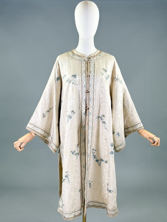 Antique 1920s Silk Embroidered Chinese Robe: Antique 1920s Silk Embroidered Chinese Robe having floral and metallic embroidery throughout closing at center front with metal ball and loop closures, fully lined. Measuring 27 inches flat across che