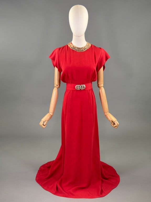 Vintage 1930s Orange Crepe Rhinestone Evening Gown: Vintage 1930s Orange Crepe Rhinestone Evening Gown having rhinestone beaded details at neck and at belt buckle with back button and snap closures. Measuring 36 - 40 inch bust, 32 inch waist, 55 inches