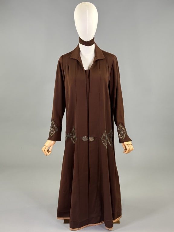 Antique 1920s Brown Wool Embroidered Shift Dress: Antique 1920s Brown Wool Embroidered Shift Dress having drop waist with embroidery and button detail at front. Removable belt. Measuring 40 inch bust, 40 inch drop waist, 47 inches long, 23 inch sleev