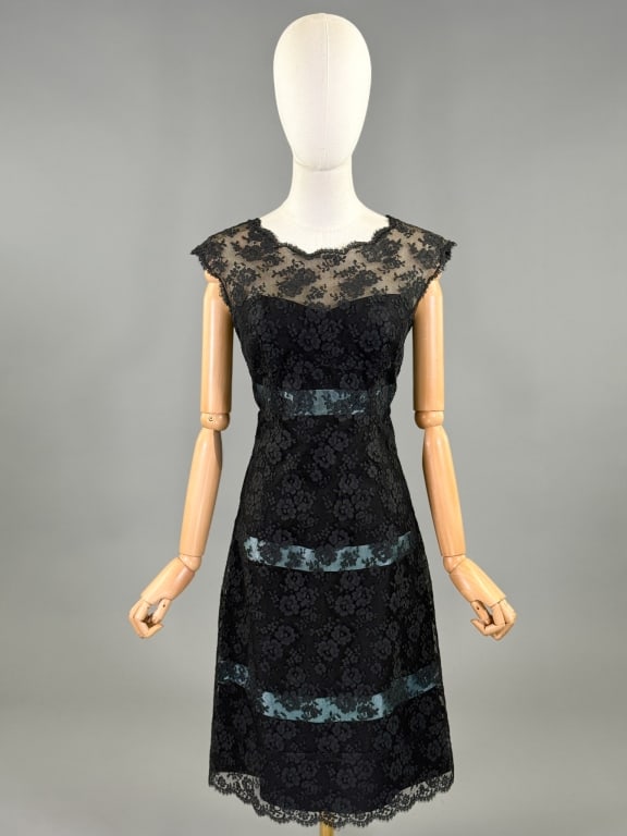 Vintage 1960s Nat Kaplan Lace Satin Bow Dress: Vintage 1960s Nat Kaplan Lace Satin Bow Dress having a-line shape with stripes of satin ribbon through body, closing at center back with zip/snaps and bow details. Measuring 34 inch bust, 28 inch wais