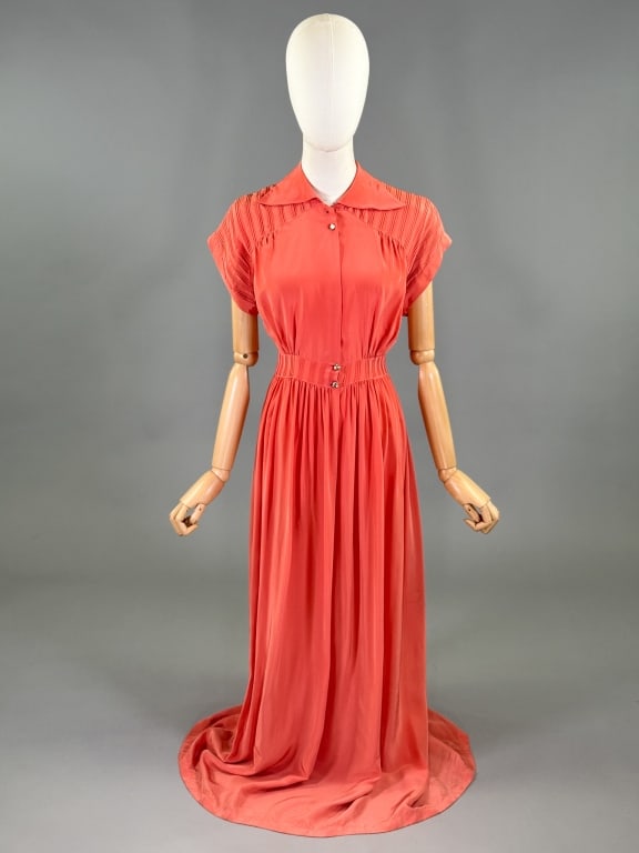 Vintage 1940s Coral Rayon Slip Dress Night Gown: Vintage 1940s Coral Rayon Slip Dress Night Gown having dagger collar at neck with pin tuck details throughout, closing at neck and waist with glass buttons. Labeled Leonora - marked size 32. Measuring
