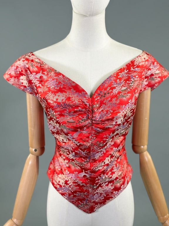 Vintage 1950s Red Silk Chinoiserie Woven Blouse: Vintage 1950s Red Silk Chinoiserie Woven Blouse Top having print throughout with ruched bust and wide neckline, closing at side with zip. Measuring 36 inch bust, 28 inch waist, 20 inches long, 4 inch