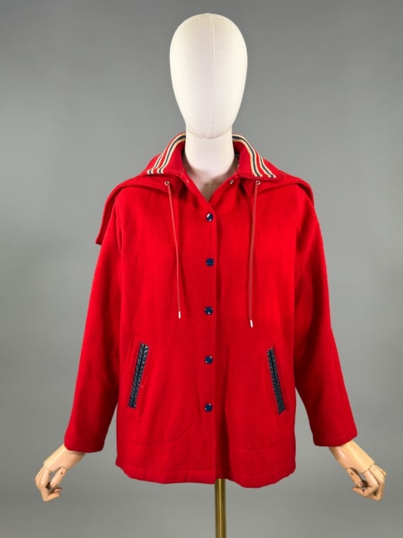 Vintage 1960s Red Wool Hooded Varsity Jacket: Vintage 1960s Red Wool Hooded Varsity Jacket having removable hood at neck with snap front closure and leather welt pockets at front. Measuring 22 inches flat across chest, 25 inches long, 21 inch sle