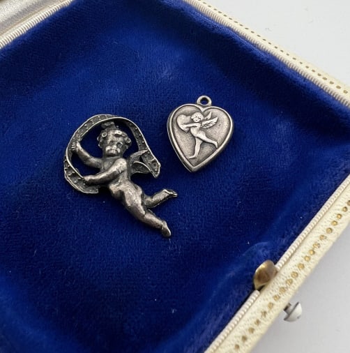 Vintage Sterling Cherub & Cupid Pendant Charms: Vintage Sterling Silver Cherub & Cupid Pendant Charms. Puffy heart cupid and repousse cherub. Larger measures 1.25 inches in length.