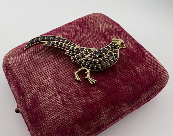 Antique Gold Over Silver & Garnet Peasant Brooch: Antique Gold Over Silver & Garnet Peasant Brooch. Having pave rose cut garnet. Measures 2 inches in length.