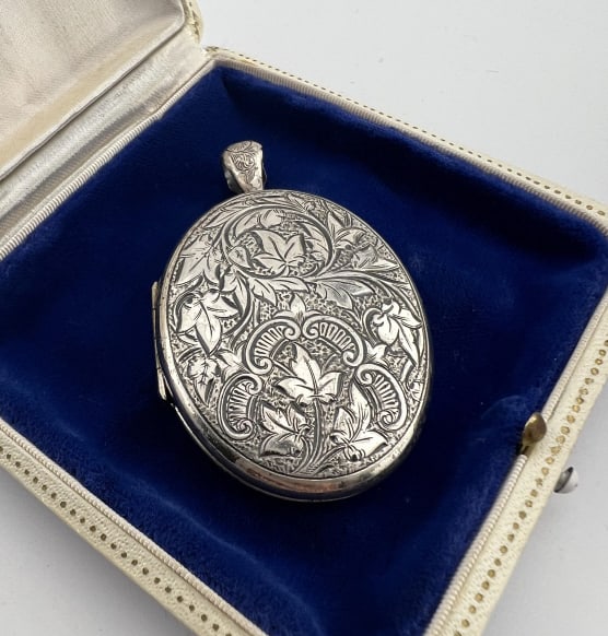Large Scale Sterling Silver Victorian Style Locket: Large Scale Sterling Silver Victorian Style Locket Necklace Pendant. Engraved scrollwork design on front and Florentine matte finish on the back. Measures 2.5 inches in length.