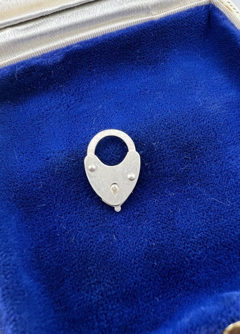 Antique Art Deco Silver Padlock Clasp or Pendant: Antique Art Deco Silver Padlock Clasp or Pendant / Charm. Measures approximately .75 of an inch in length. Top arched portions opens.