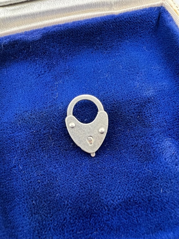 Antique Art Deco Silver Padlock Clasp or Pendant: Antique Art Deco Silver Padlock Clasp or Pendant / Charm. Measures approximately .75 of an inch in length. Top arched portions opens.