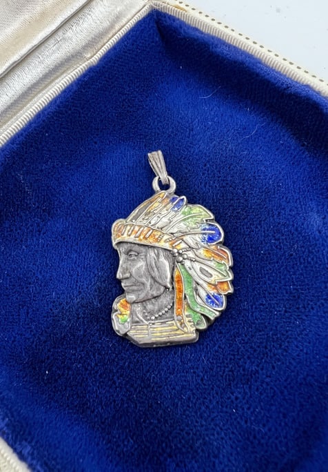 Vintage Native American Sterling & Enamel Pendant: Vintage Native American Sterling & Enamel Pendant. Native American chief with enamel decorated headdress. Marked STERLING on the back. Measures 1.5 inches in length.