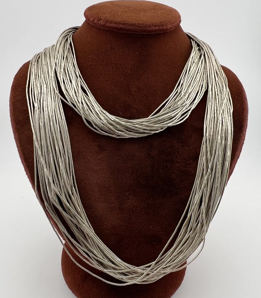 Native American Sterling Liquid Silver Necklace: Vintage Native American Sterling Liquid Silver Necklace. Impressive thirty strand liquid silver beaded Native American necklace. Hallmarked on clasp. Measures approximately 30 inches in length.